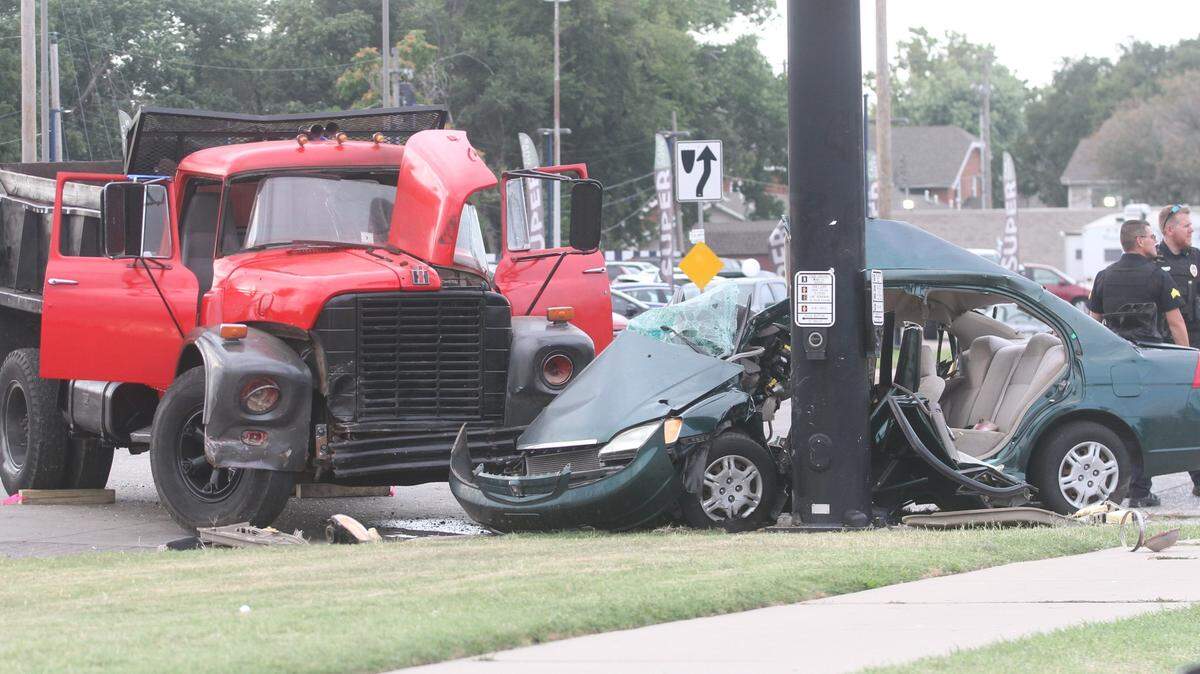 Police said two men in a Honda car were injured during a wreck Tuesday evening near Pawnee and Broadway. Police said the driver of the dump truck fled the scene.