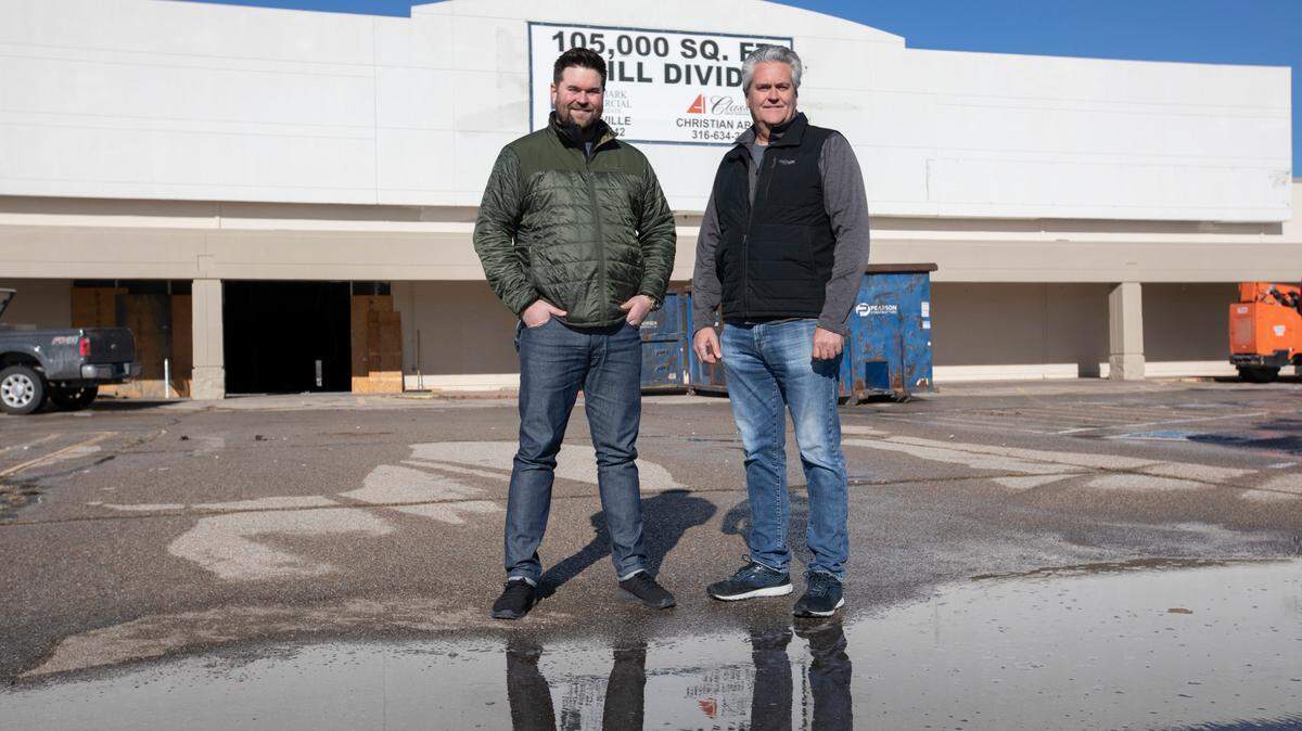 Jordan Storey, left, and his father, Jay Storey, are opening their second Wichita Furniture & Mattress store in the space where Kmart used to be at 4200 W. Kellogg.
