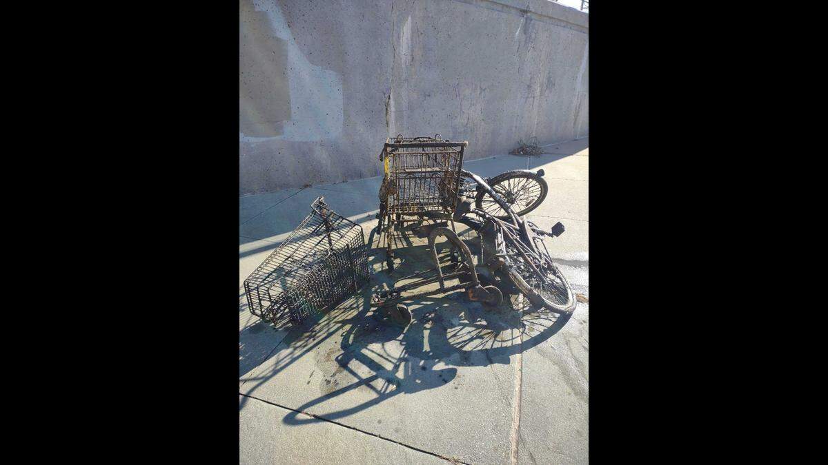 Hundreds of items, including about 100 electric scooters, shopping carts and bicycles, were pulled from the Arkansas River in downtown Wichita this week.
