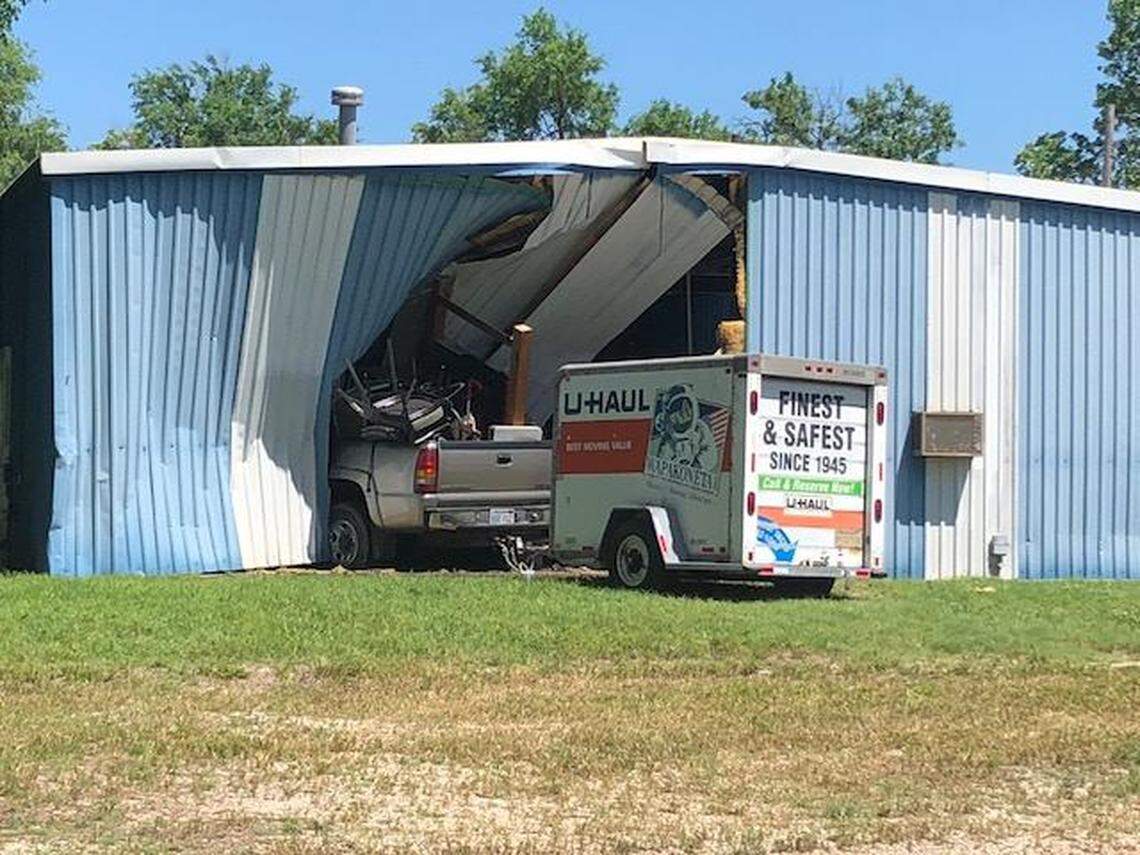 After the silver truck hit a Greenwood County Sheriff's Office patrol truck, it continued into the garage,  a spokesman with the sheriff's office said on Sunday. The truck was pulling a U-Haul trailer.