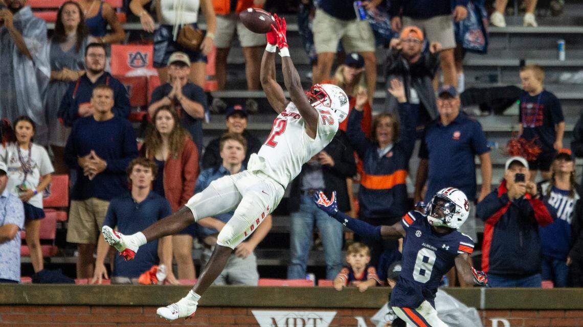 New Mexico Lobos wide receiver Caleb Medford (12) catches a pass in the end zone for a touchdown as Auburn Tigers take on New Mexico Lobos at Jordan-Hare Stadium in Auburn, Ala., on Saturday, Sept. 14, 2024.
