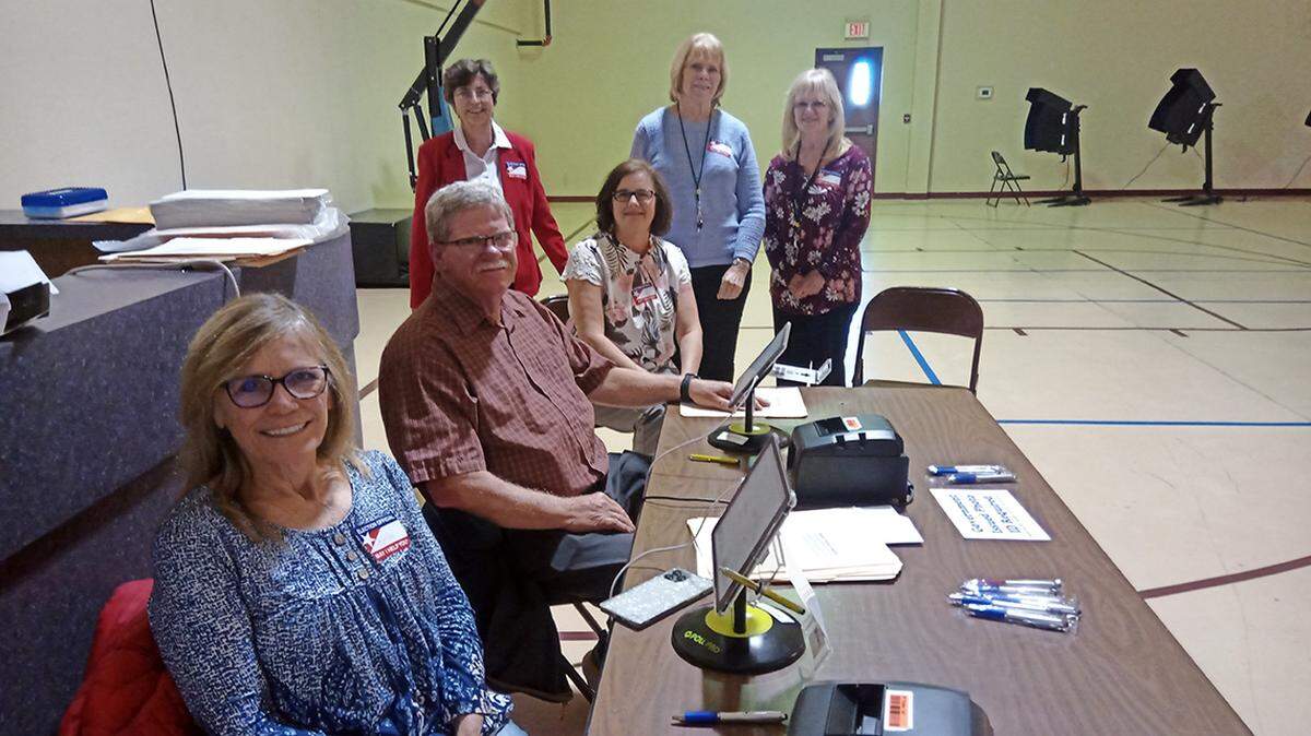 Poll workers on Kansas' presidential primary day, March 19, 2024.