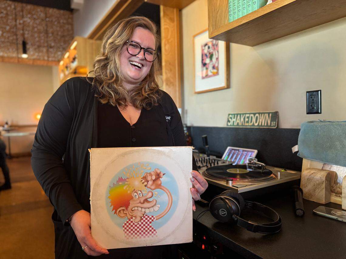 Kirsten Phillips and her husband, Adam Phillips, who are owners of Spektrum Muzik, spin the records at First Mile Kitchen’s “Monthly Moods” vinyl nights. She’s pictured during last month’s Grateful Dead-themed dinner.