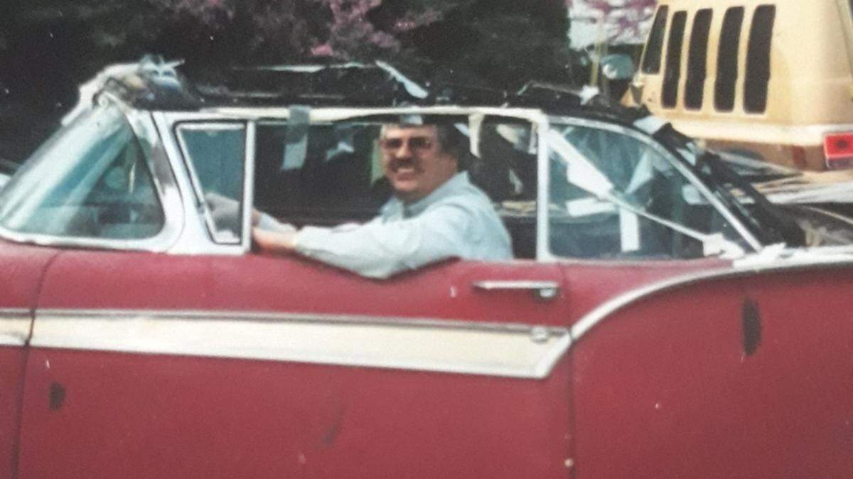Gary Carpenter, who founded the Automobilia store and car show, pictured around 1999 when he purchased a ’57 Ford convertible. Carpenter, who died Monday, was sitting on a bucket for this photo and always had planned to restore the car.