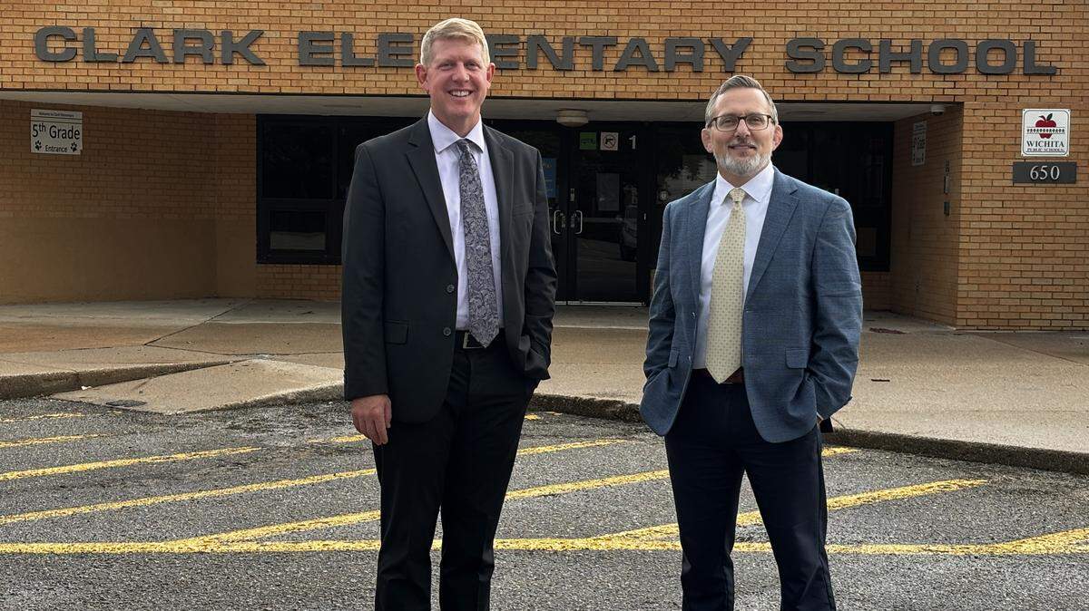 Wichita school superintendent Kelly Bielefeld, left, with Tim Dernlan, right, head of school at the Wichita Classical School. The school is buying the former Clark Elementary to expand its classrooms.