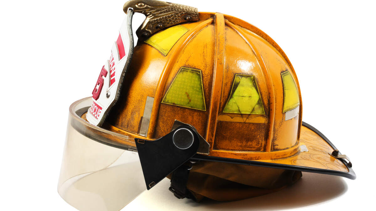 A photo of a yellow firefighter’s helmet.