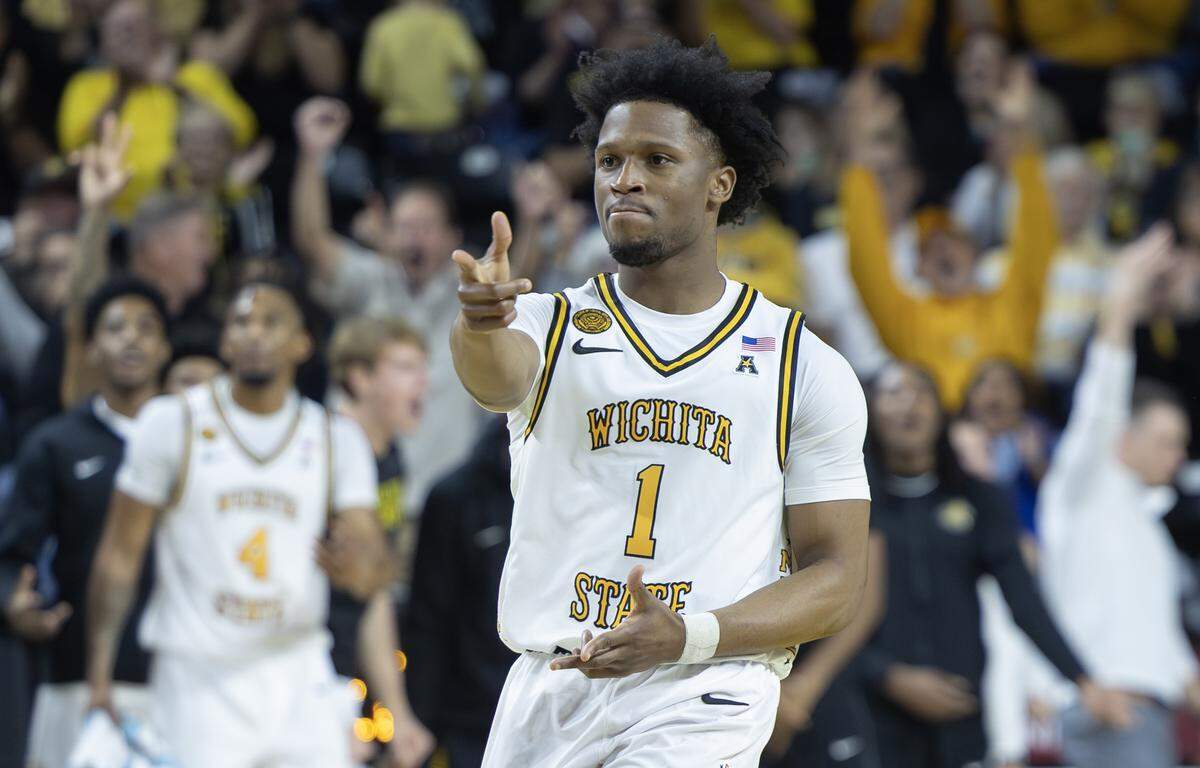 Wichita State’s Kenyon Giles celebrates a three pointer during the first half of their game against Loyola at Koch Arena on Thursday.