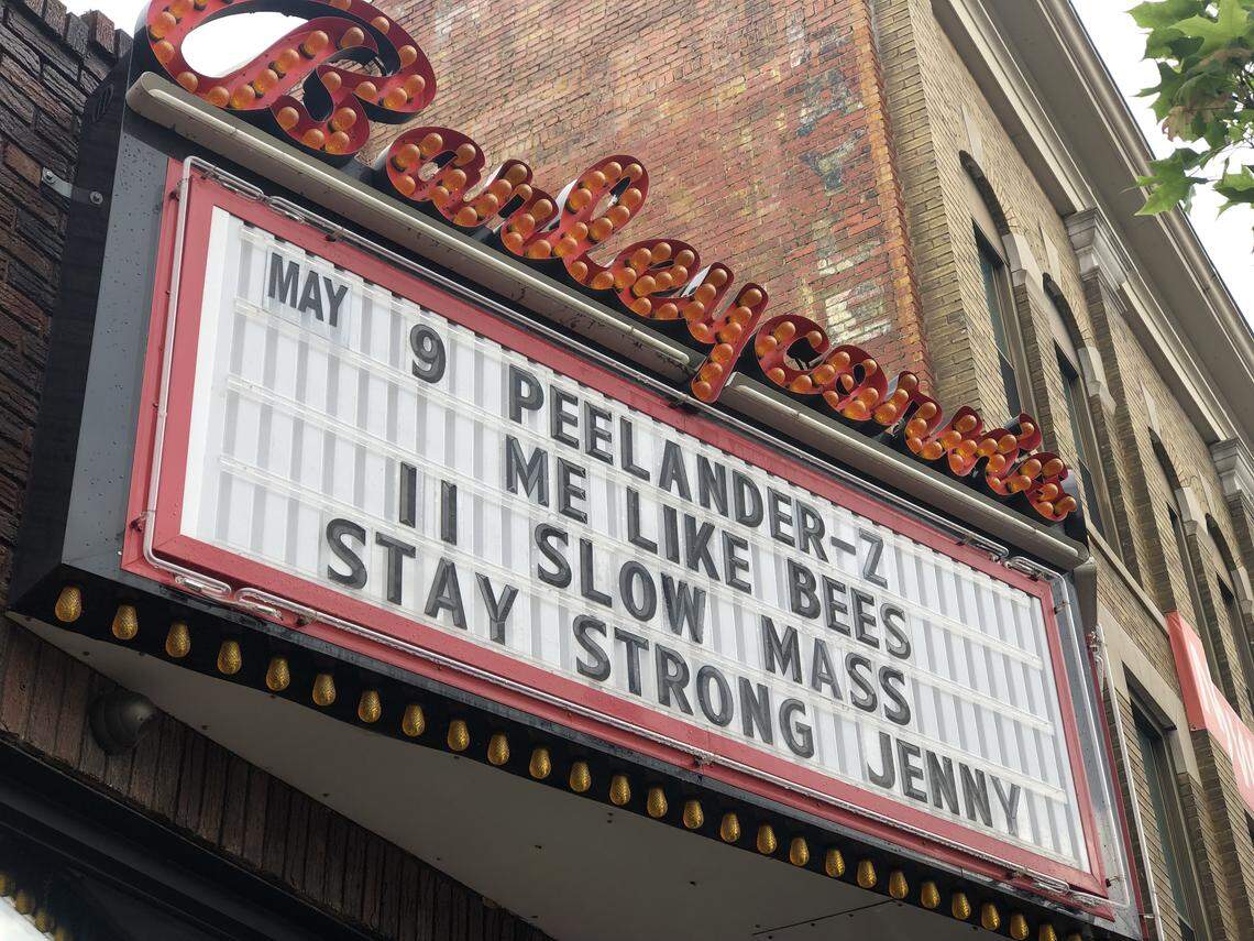 The marquee at Barleycorn’s displays a message for Jenny Wood on Tuesday. The popular performer was critically injured in a downtown crash Sunday that killed her mother and niece.