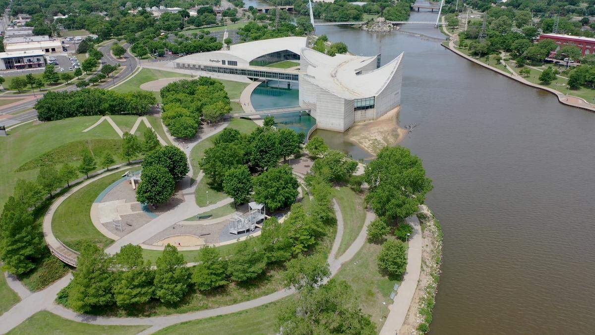 Six acres on the southeast side of Exploration Place’s campus (pictured in the foreground of the photo) are being transformed into a playground adventure area.