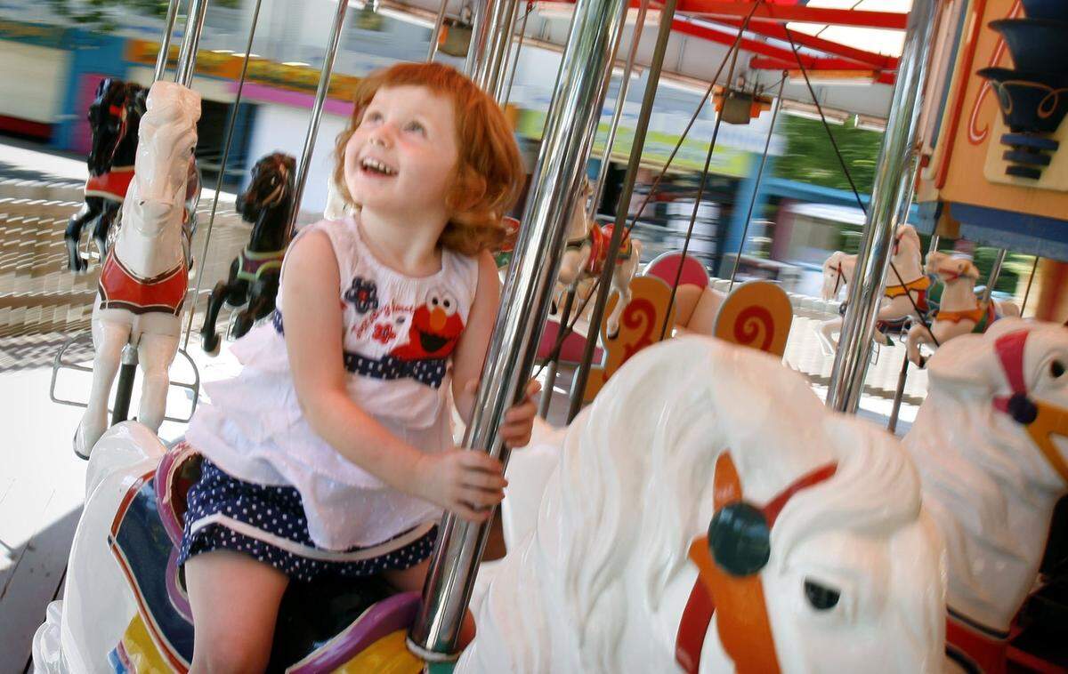 FILE A child enjoys her ride on the Joyland carousel in 2006.
