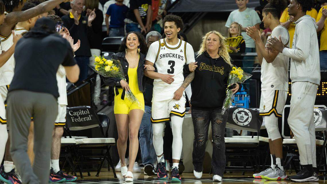 WIchita State senior Craig Porter Jr., celebrates senior day with his family after the Shockers’ defeated South Florida on Sunday.
