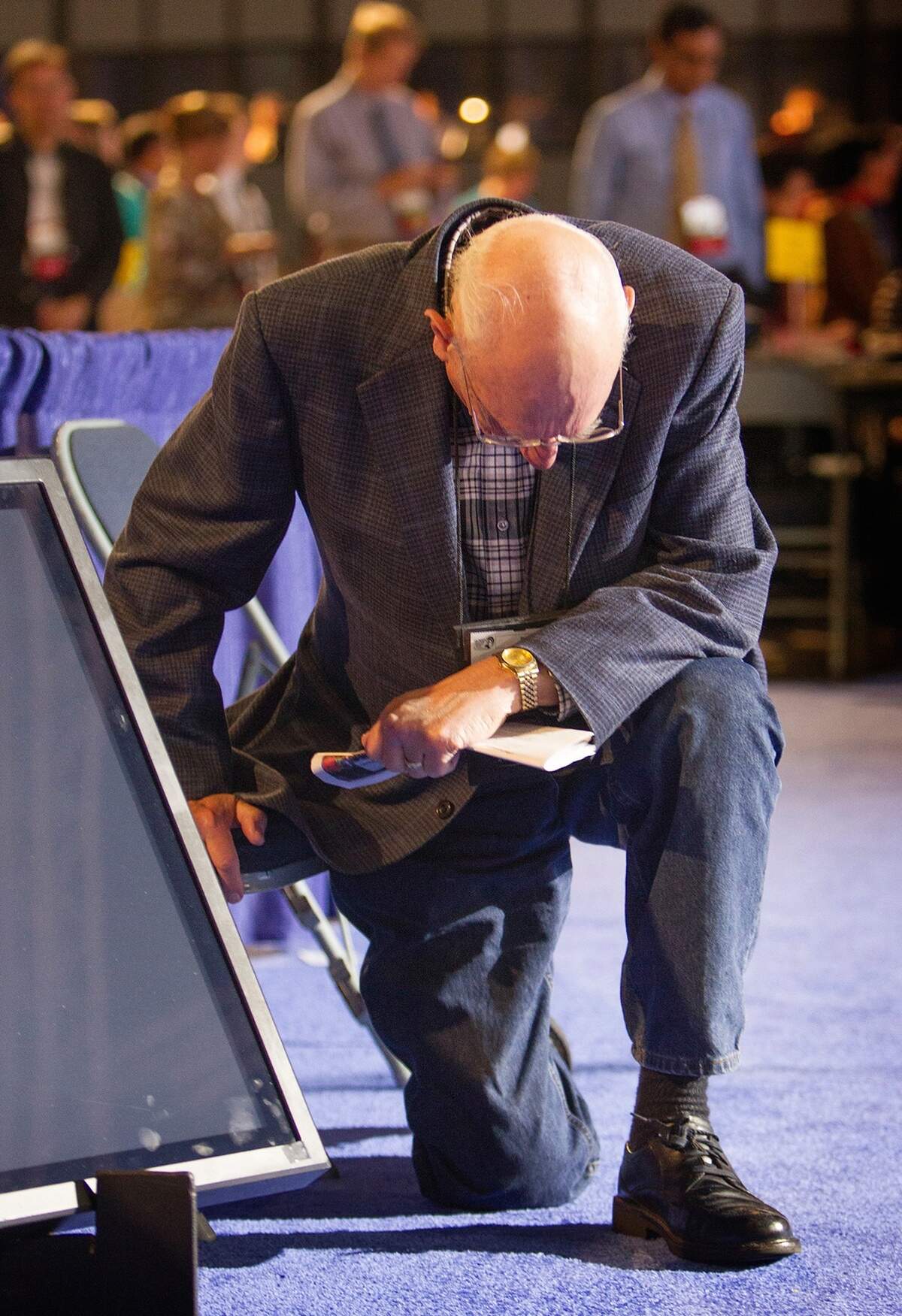 Bishop Richard Wilke shown kneeling at the 2012 United Methodist General Conference in Tampa. “He was just a man of great humility and service,” said fellow Bishop David Wilson.