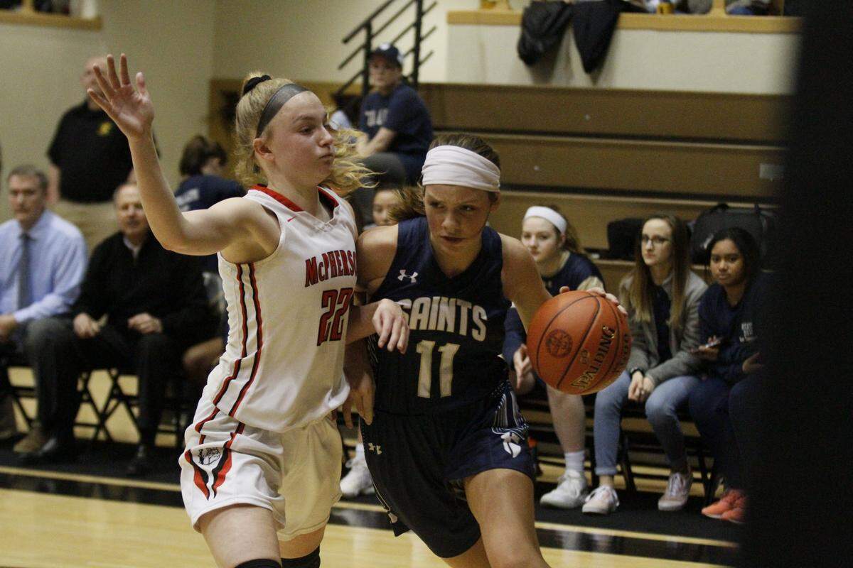 McPherson’s Grace Pyle guards St. Thomas Aquinas’ Blythe Pearson during Friday’s semifinal in Emporia.