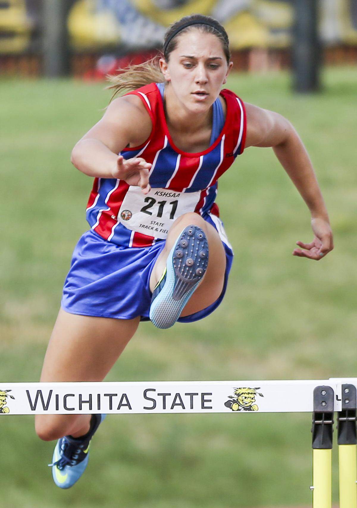 Cheney's Taylor Needham wins the 300 meter hurdles at the state track and field meet at Cessna Stadium. She also won the 100 and 200 meter dash.  (May 31, 2014)