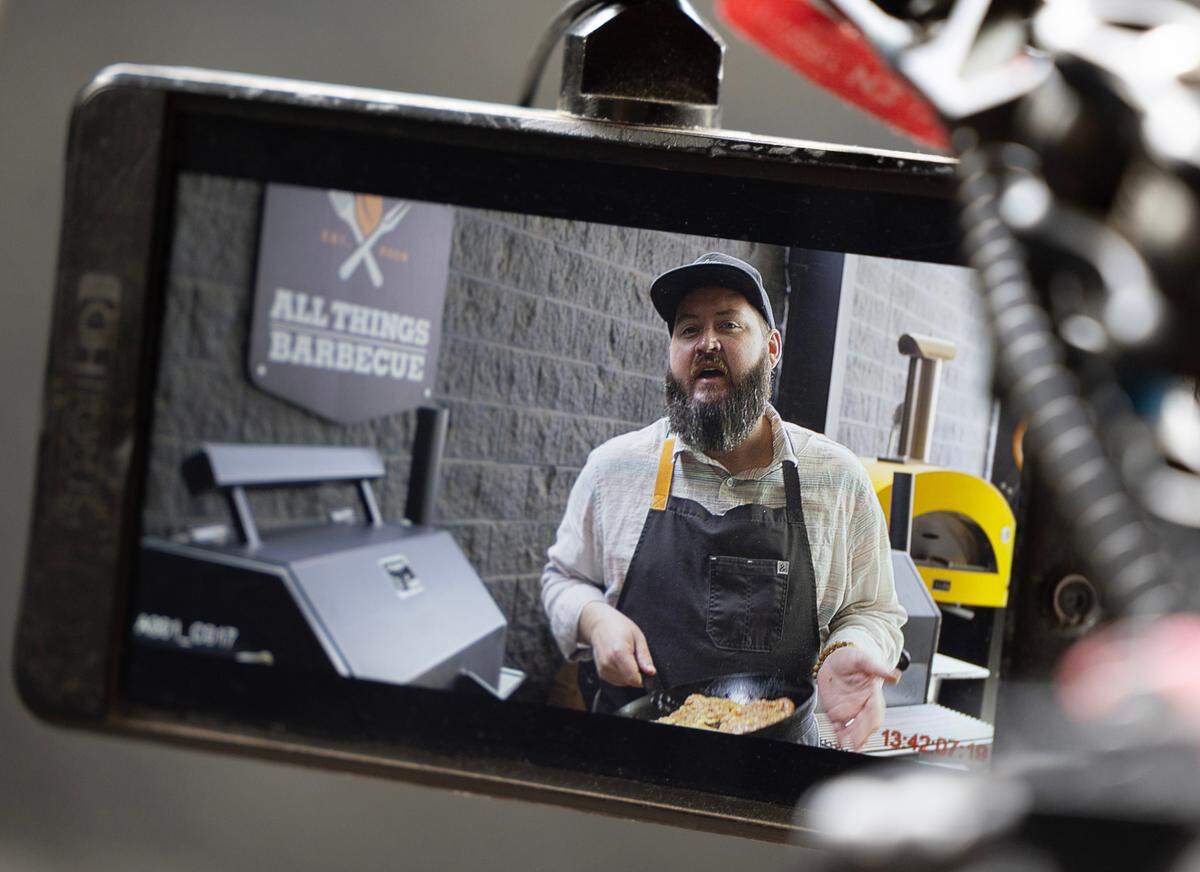 Justin Cary, a professional cinema photographer and the son of All Things BBQ owner Don Cary, films and edits Chef Tom Jackson’s popular online cooking series, “The Sauce.”