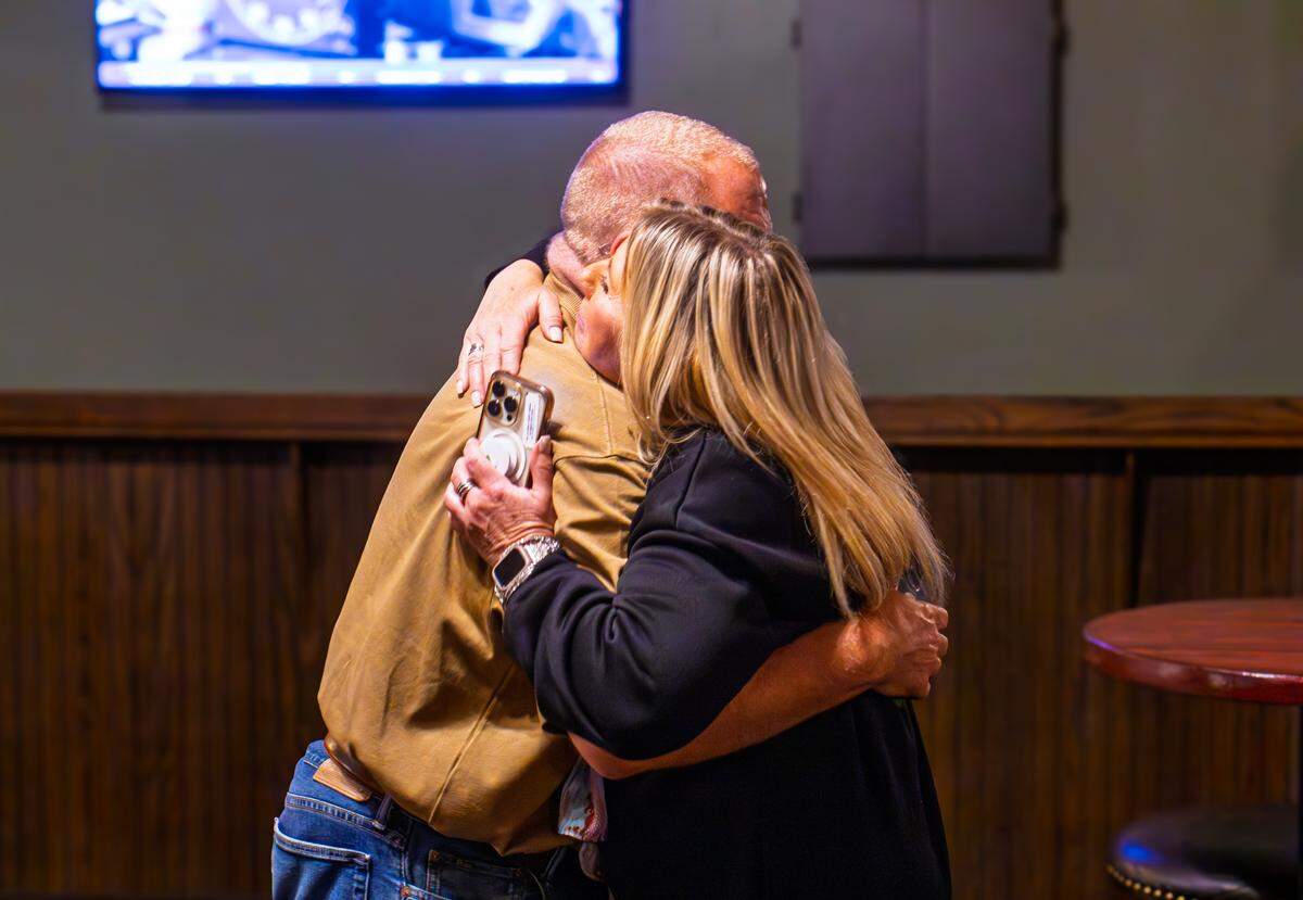 Amy Jensen hugs a friend after unofficially winning the Wichita Public School District 5 school board seat Tuesday evening. Jensen beat incumbent Kathy Bond in the Nov. 4 election.
