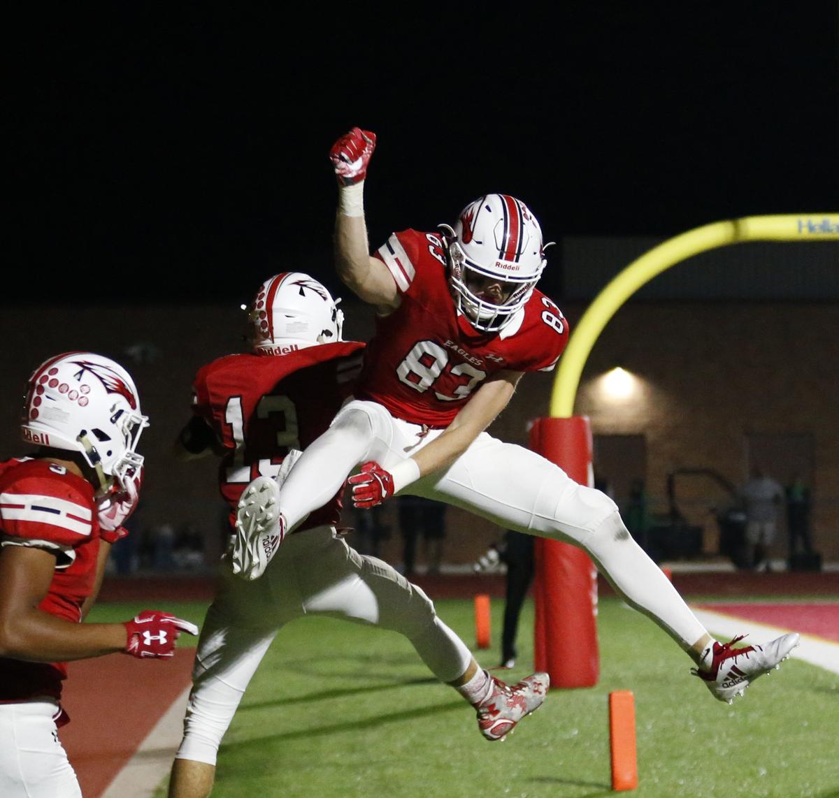 Maize wide receiver #83 Driq Doty celebrates with #13 Jordon Helm after Helm scored on a pass play from Caleb Grill. (October 19, 2018)