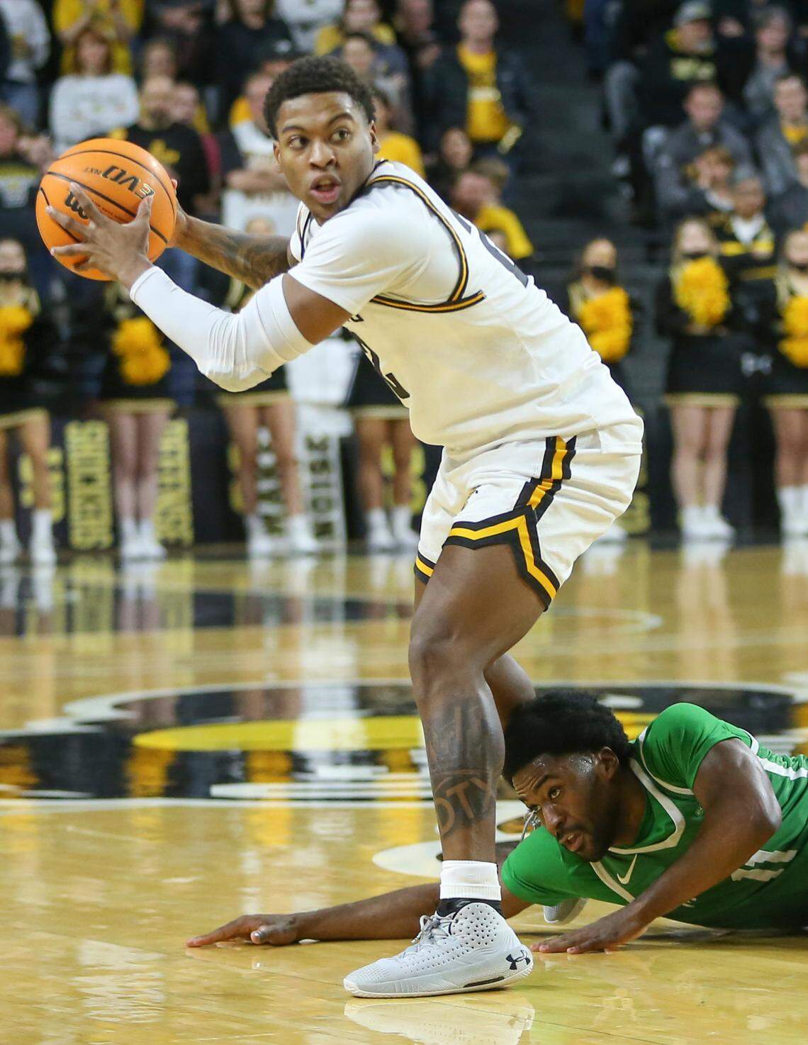 Wichita State’s Qua Grant looks for a pass while North Texas’ JJ Murray defends during the second half.