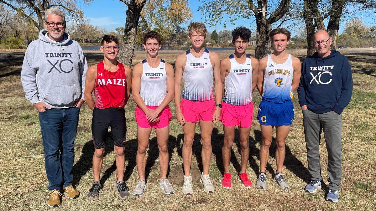 The 2022 Wichita Eagle All-Metro boys cross country team. From left to right: Trinity coach Eric Carroll, Maize’s Kaleb Glazier, Trinity’s Jacob Hobson, Trinity’s Clay Shively, Trinity’s Sam Ferguson, Collegiate’s C.J. Meyer, Trinity coach Randy Mijares. Not pictured: Kapaun’s Luke Brock and Collegiate’s Will Meyer.