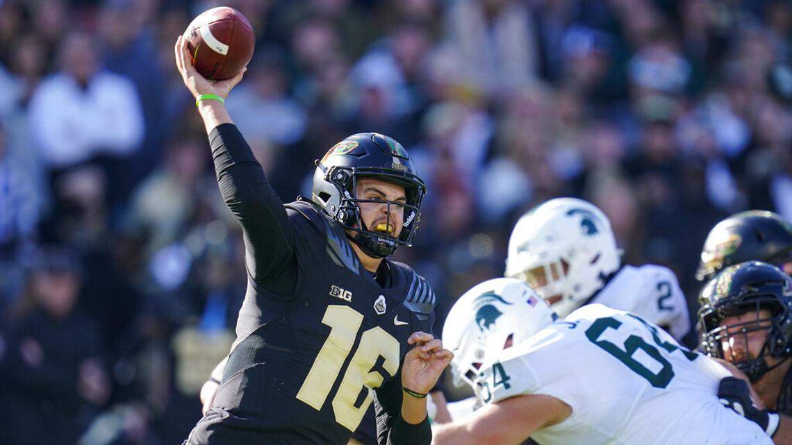Purdue quarterback Aidan O’Connell (16) throws against Michigan State during the first half of an NCAA college football game in West Lafayette, Ind., Saturday, Nov. 6, 2021. (AP Photo/Michael Conroy)