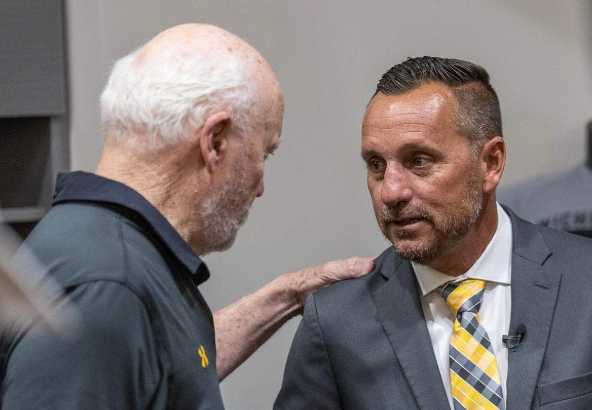 Brian Green meets with legendary college baseball coach Gene Stephenson after Green was introduced as the newest coach of WIchita State baseball during a press event on Wednesday at Eck Stadium. Green comes to WSU from Washington State University. 