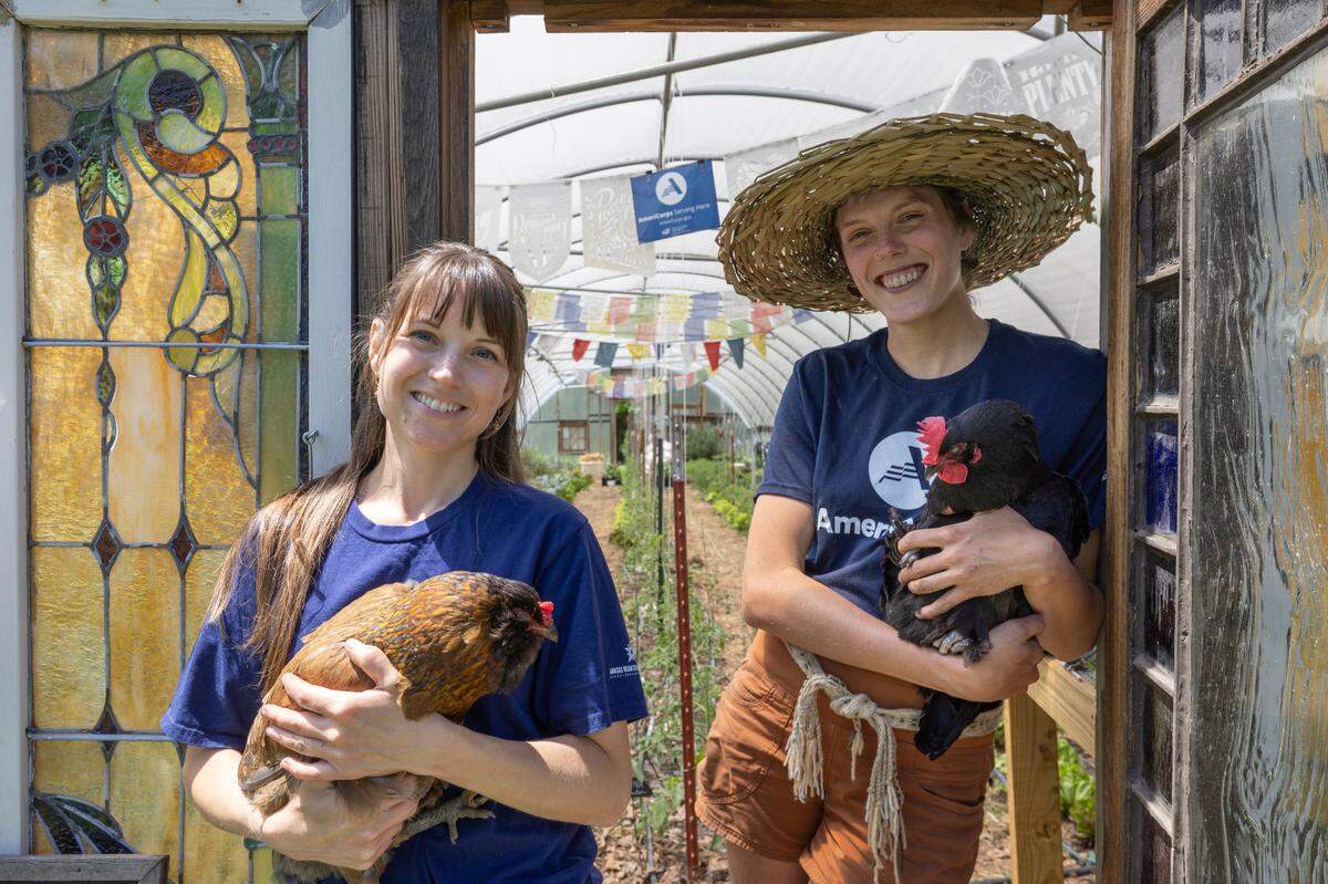 Deanna Dreiling, left, and Annie Friesen are employees at Bartlett Arboretum whose positions were funded by the AmeriCorps program. Funding for AmeriCorps jobs in Kansas has been eliminated. Dreiling and Friesen help run Bartlett Arboretum’s farm to table food program.
