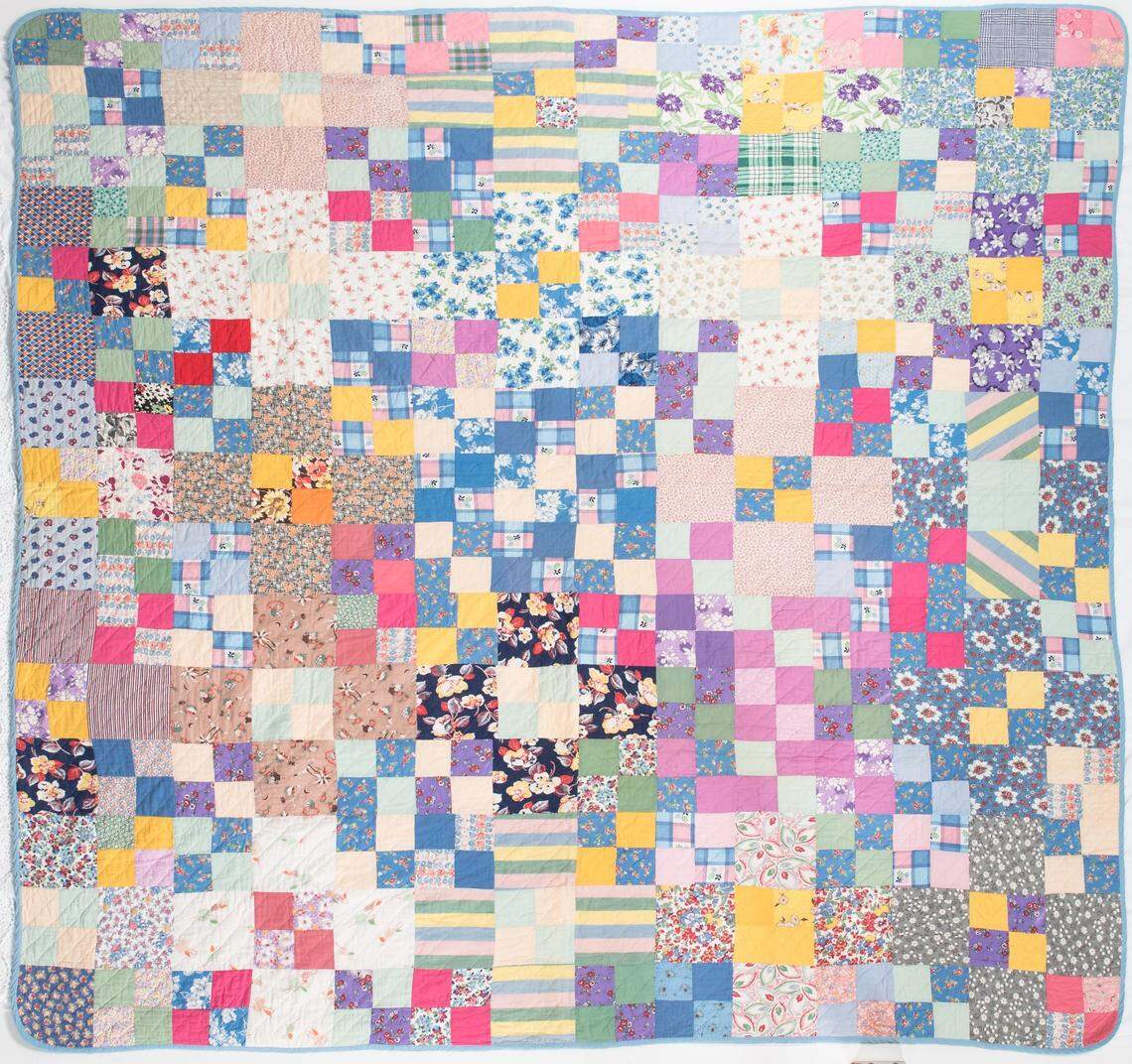 Besides garments and feed sacks, the “Thrift Style” exhibition at the Wichita-Sedgwick County Historical Museum also includes quilts, such as this four-patch quilt, circa 1930.