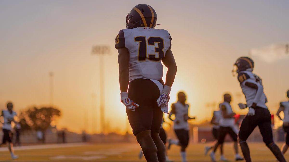 Northwest running back Cencere Thompson celebrates a touchdown in the Grizzlies win over East on Friday.