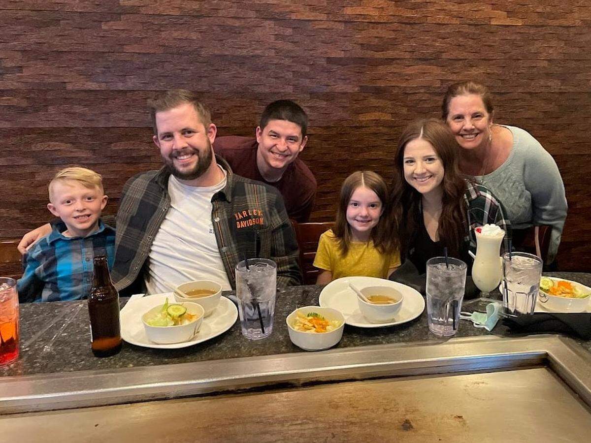 Kathy Dame (right) celebrating her a birthday for her son-in-law (center) alongside her children and grandchildren in 2023 at Kobe Steak House of Japan.