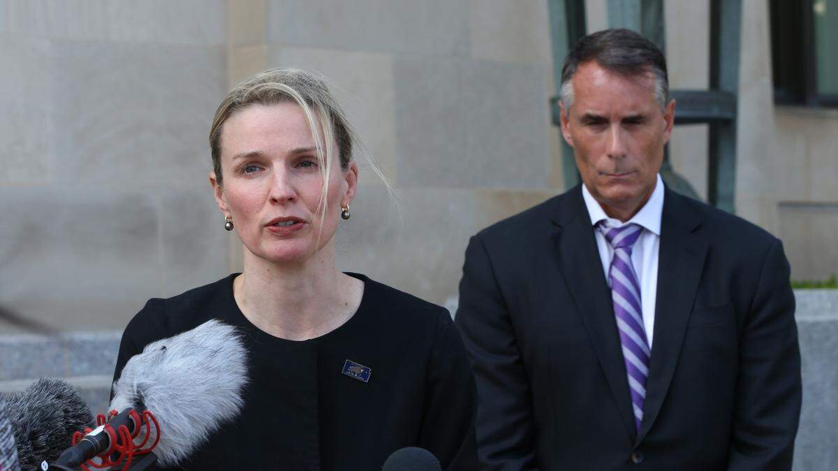 U.S. Attorney for the District of Kansas Kate Brubacher, flanked by FBI Special Agent-in-Charge Stephen Cyrus, addresses reporters outside the federal courthouse in Wichita on Monday after a former Kansas bank executive was sentenced 24 years in prison for embezzling tens of millions of dollars.