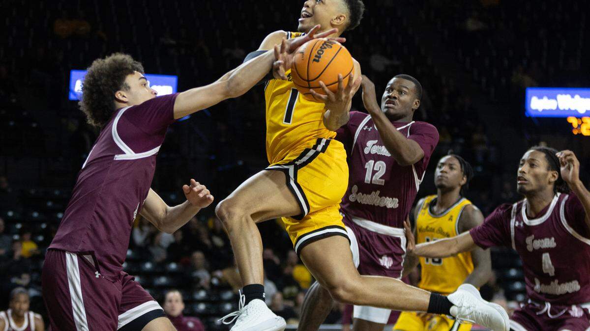 Wichita State’s Xavier Bell tries to get through a group of Texas Southern defenders on his way to the basket during the first half of their game Thursday night.