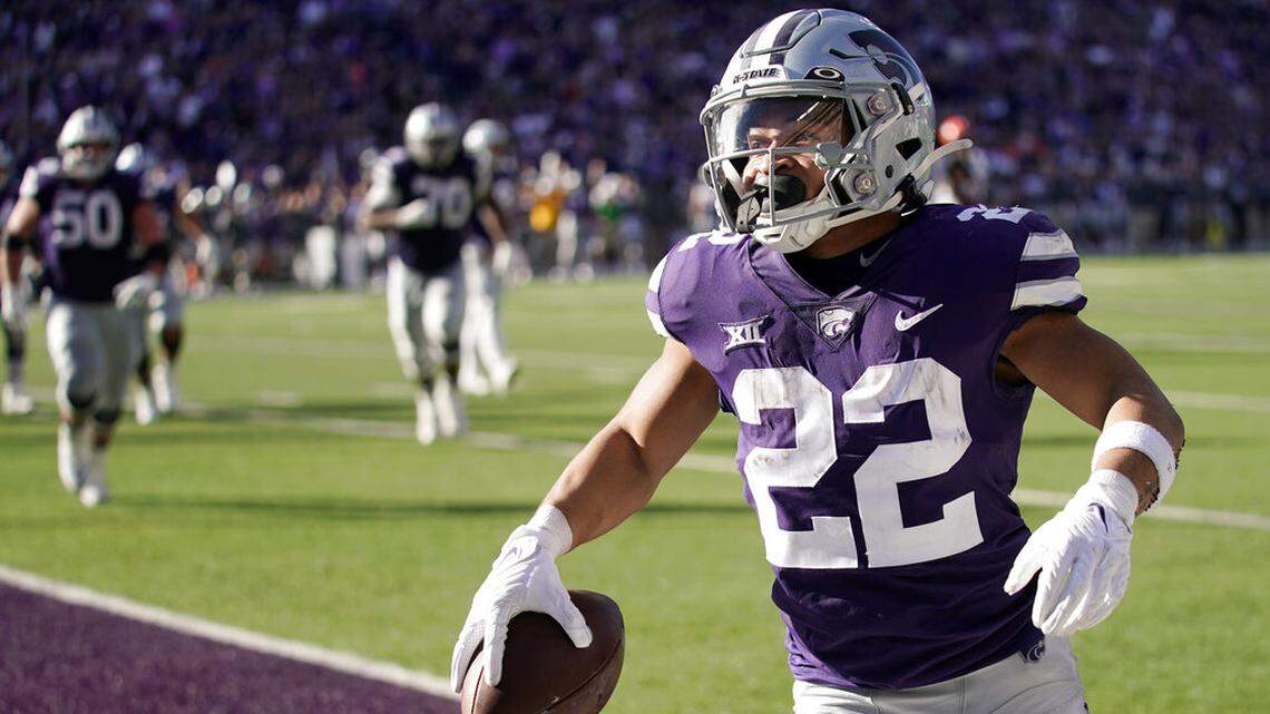Kansas State running back Deuce Vaughn celebrates after scoring a touchdown during the first half of an NCAA college football game against Oklahoma State Saturday, Oct. 29, 2022, in Manhattan, Kan. (AP Photo/Charlie Riedel)