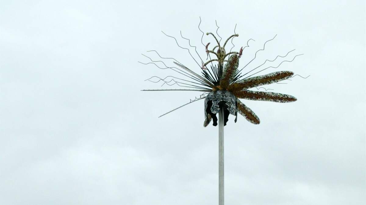 Artists Tim Berg, Chris Frank, and Ed Langston created "Passiflora Sorma," a sculpture that was displayed near the intersection of Central and Zoo Blvd.