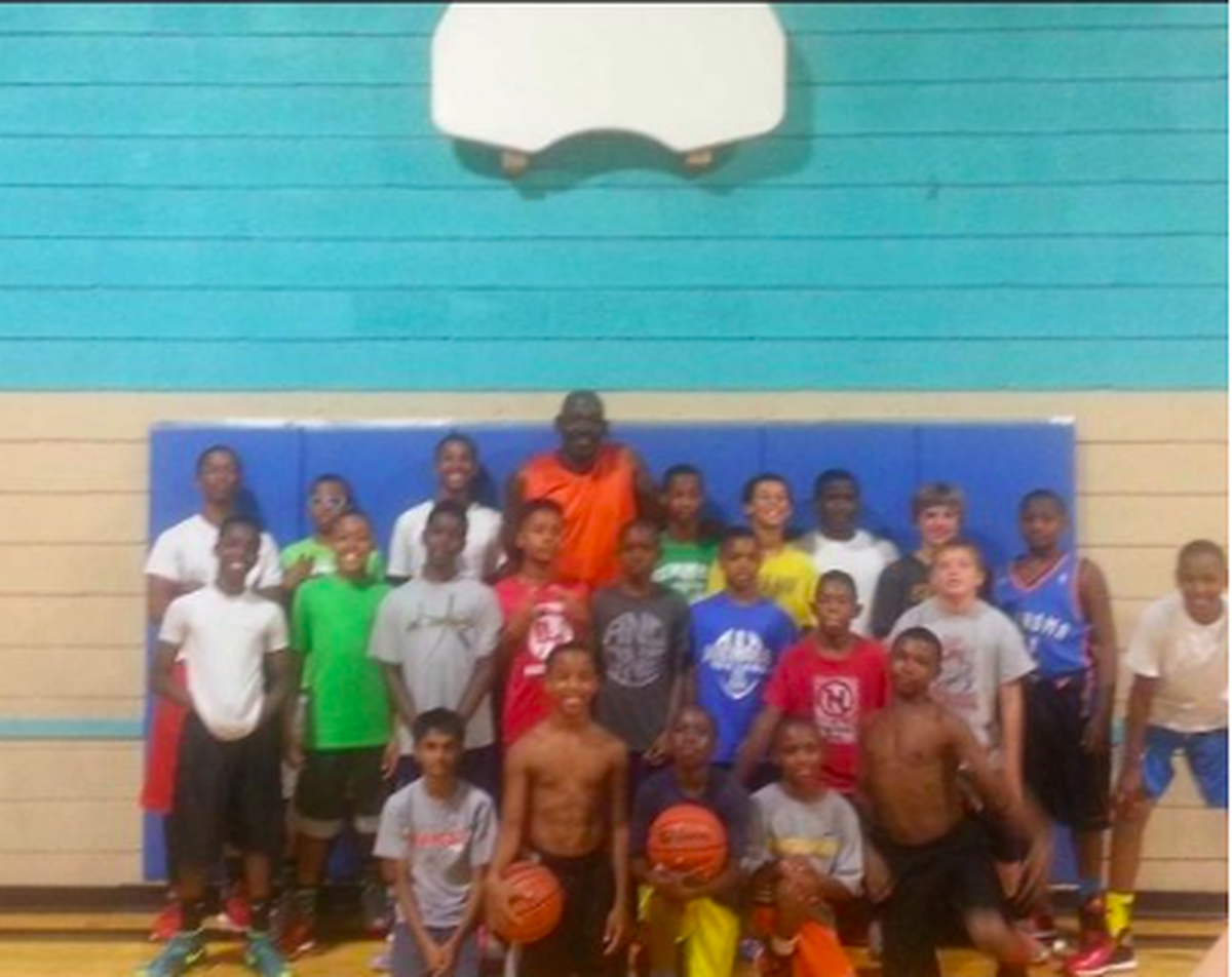 Sterling Chapman (second-to-left on front row) was a fourth-grader at Antoine Carr’s basketball camp in Wichita.