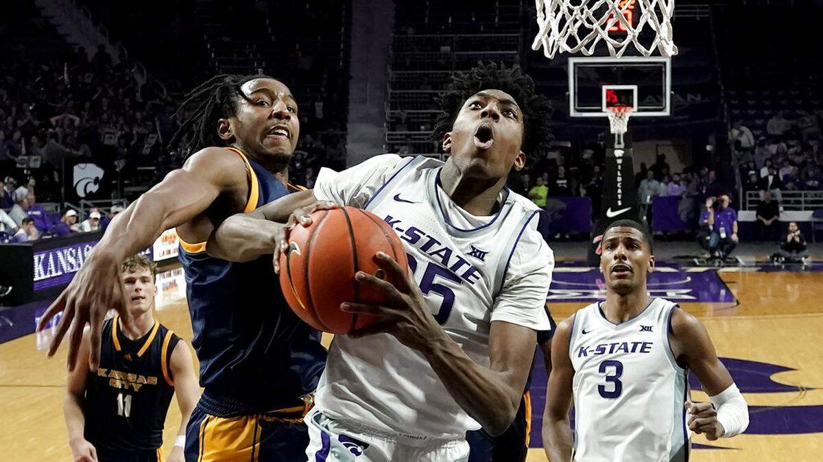 Kansas State forward Nae’Qwan Tomlin (35) shoots under presssure from Kansas City guard Shemarri Allen (5) during the second half of an NCAA college basketball game Thursday, Nov. 17, 2022, in Manhattan, Kan. Kansas State won 69-53. (AP Photo/Charlie Riedel)