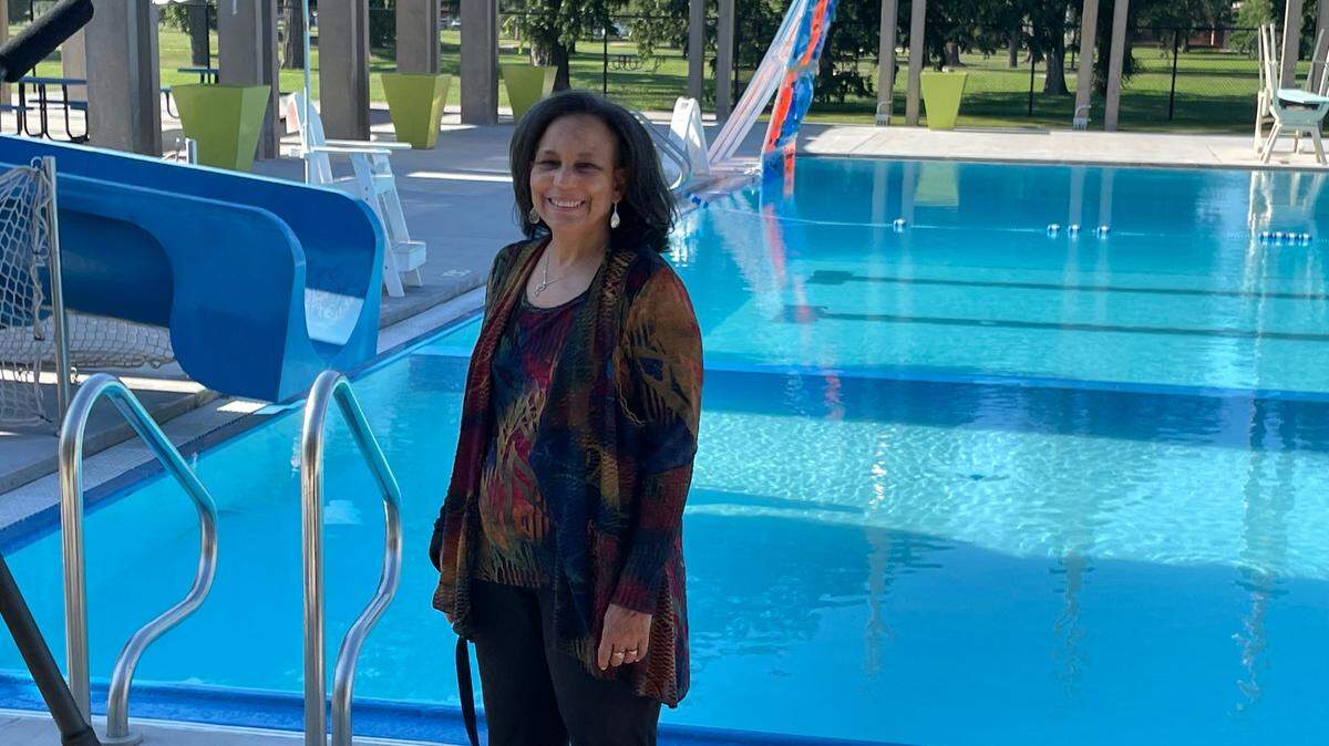 Cheryl McAfee, CEO of McAfee3 architectural studio, stands in front of the swimming pool at McAdams Park that was renamed Charles McAfee Pool after her father, who designed the facility and adjoining pool house in his iconic modernist style. The city has secured $150,000 in grant funding for upgrades at the pool and the development of a historical preservation plan.