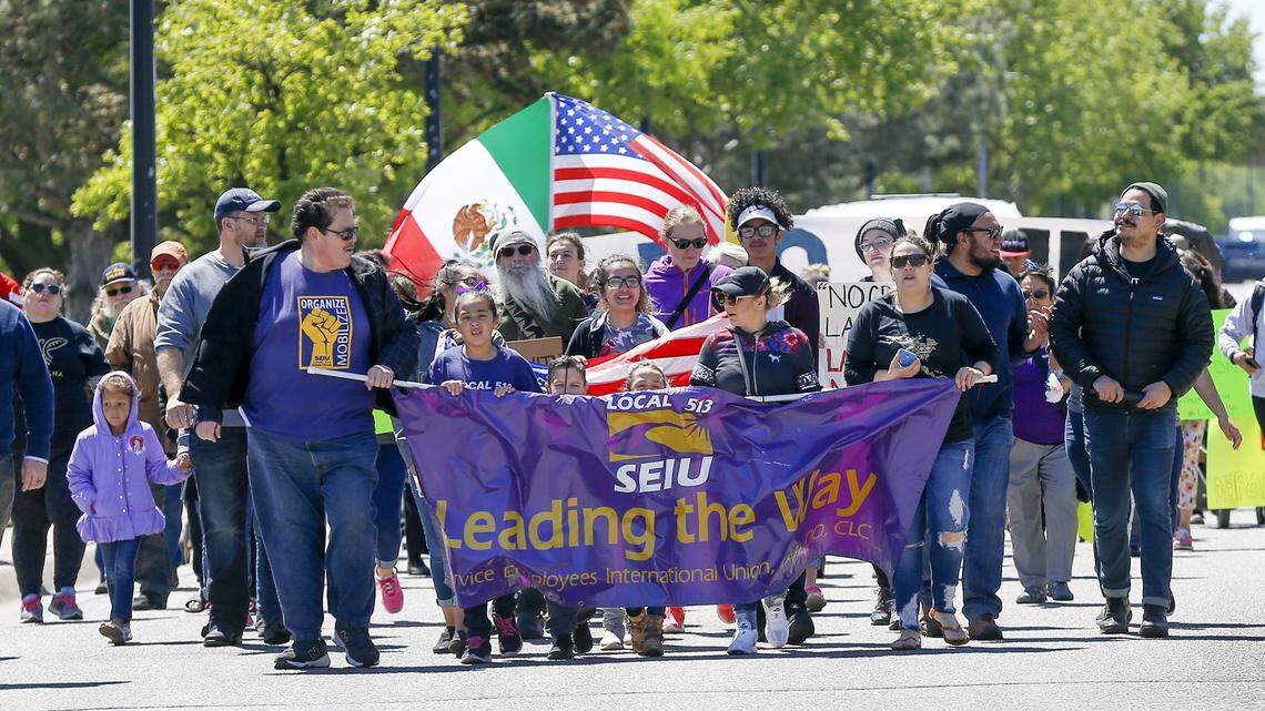 Local Hispanic residents march down McLean by Lawrence-Dumont Stadium as they join a national march and strike called 'A Day Without Immigrants" in May 2017.