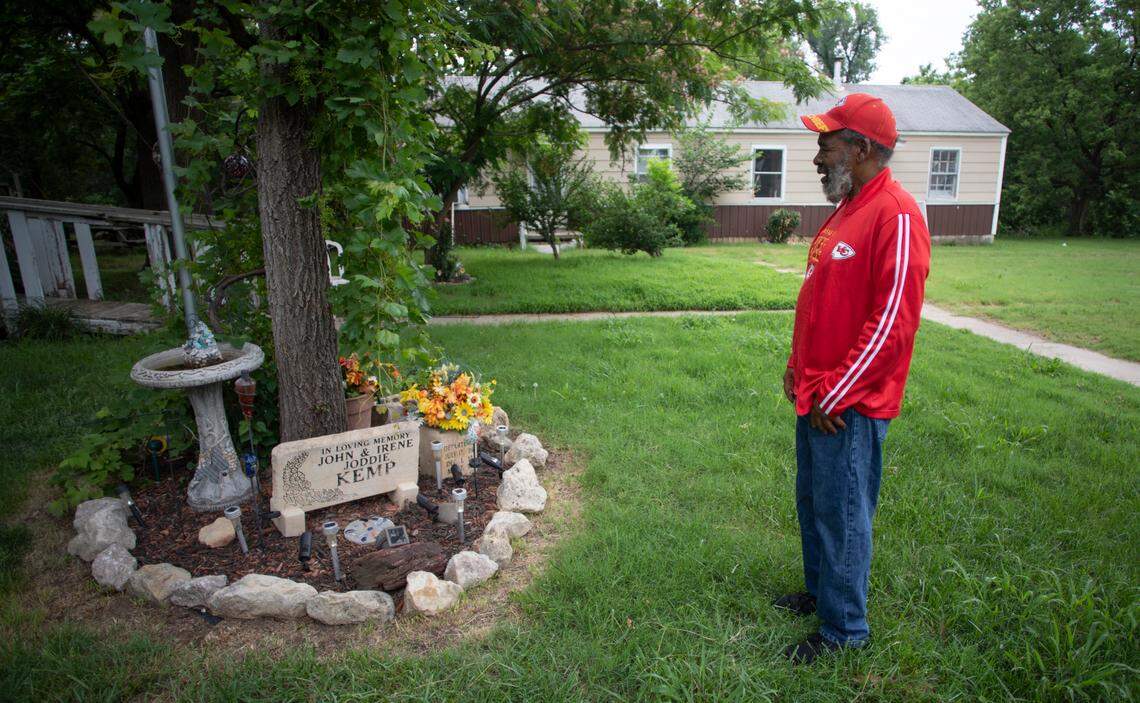 Chauncey Kemp looks over a memorial honoring his family at the Planeview property his family has owned since his grandfather purchased it when the neighborhood was brand new. He says aroma from a nearby wastewater treatment plant has permeated the area his entire lifetime.
