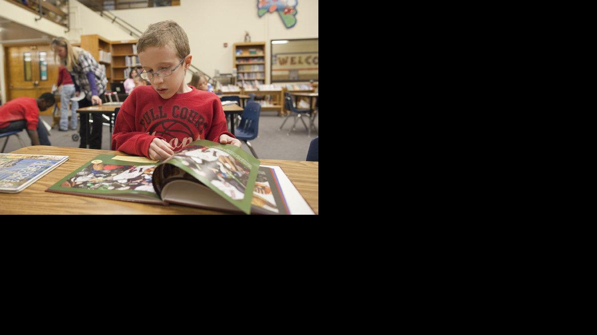 Taylor Parsons reads in the library of John Bryant Elementary. (Feb. 3, 2012)