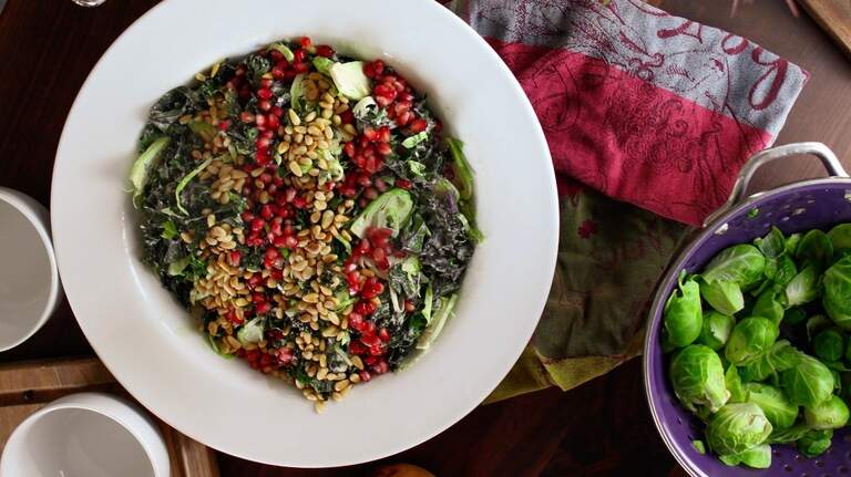 Kale and Brussels sprouts are the stars of this hearty salad that takes minutes to make
