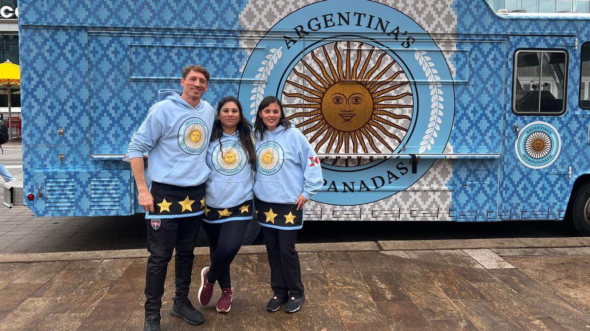 Chad Freeman, left, and his wife Carolina Brandan, center, are the owners of Argentina’s Empanadas, a Wichita business that will be featured on the 17th season of “The Great Food Truck Race,” which starts airing on Sunday, June 30. Their team was rounded out by Paola Mentis, a friend of the couple and the owner of Wichita Argentinian dessert business Konkeh Artisan Alfajor Pastries 