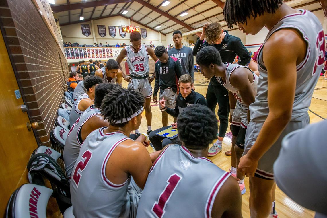 Sunrise Christian Academy basketball coach Luke Barnwell talks with his team during game with the Universal Academy Eagles from Irving, Tx., in Bel Air Thursday night. Sunrise Christian Academy just north of Wichita, has produced 63 Division I menÕs college basketball players