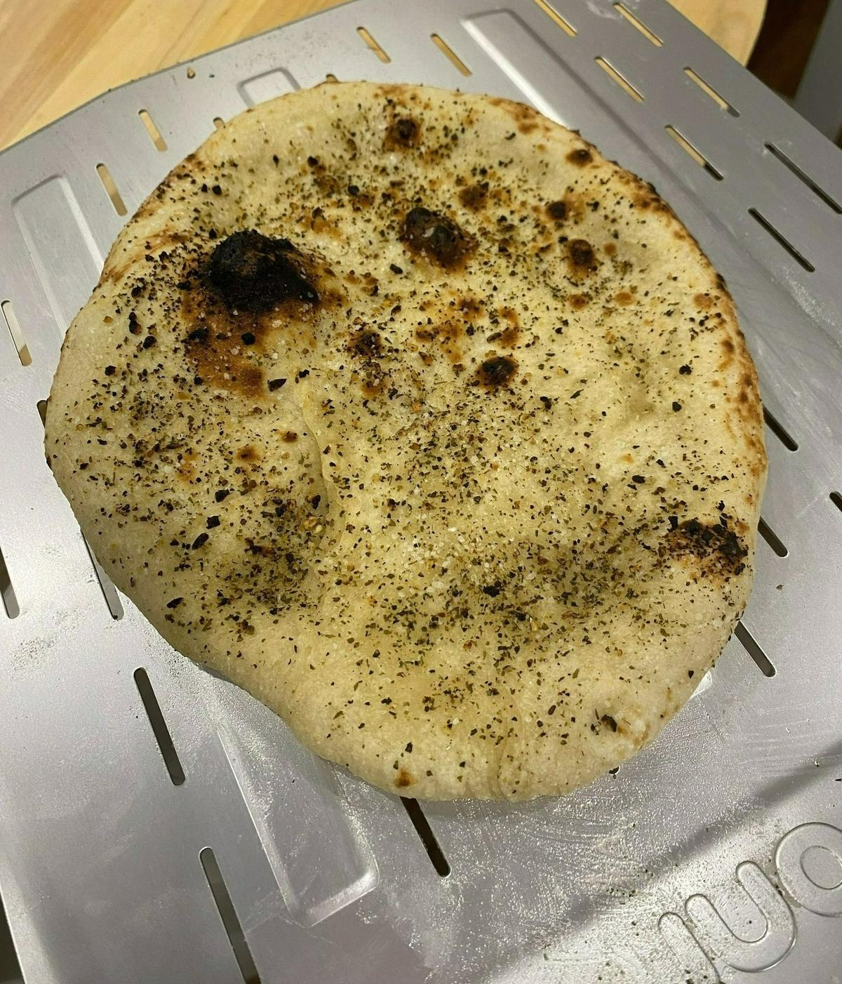An appetizer from the Ooni oven made using Piatto dough, brushed-on olive oil, kosher salt and a dried herb blend