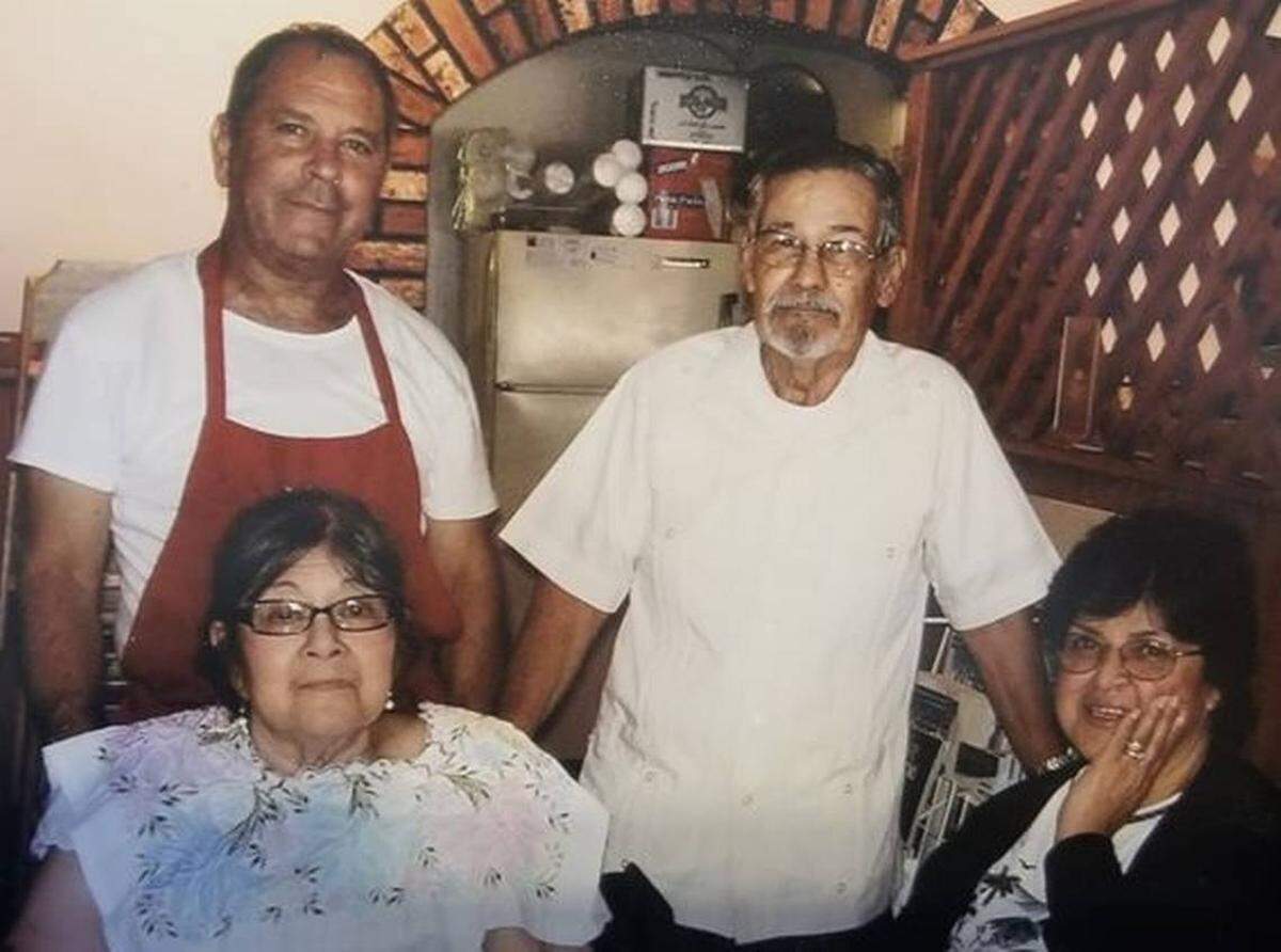 Arnoldo Fernandez, top left, and his wife, Clara, bottom right, pictured in the original Chico’s restaurant at Douglas and West along with the restaurant’s co-founders and Clara’s parents Magdalena Rizo, bottom left, and Francisco Rizo, top right.