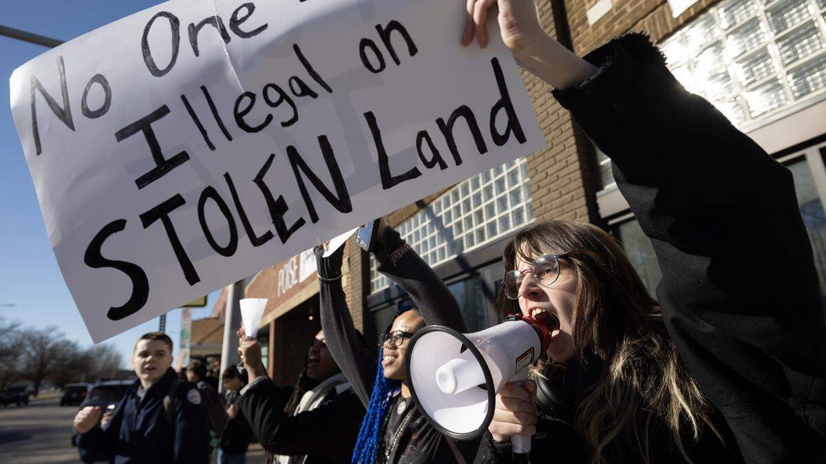 Students from Wichita East High School staged a walk-out protest to speak out about activities by federal immigration agents.