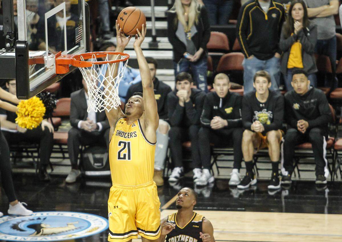 Wichita State forward Jaime Echenique scores on a lob pass with less than a minute to go during the second half of their game against Southern Miss at Intrust Bank Arena on Saturday.