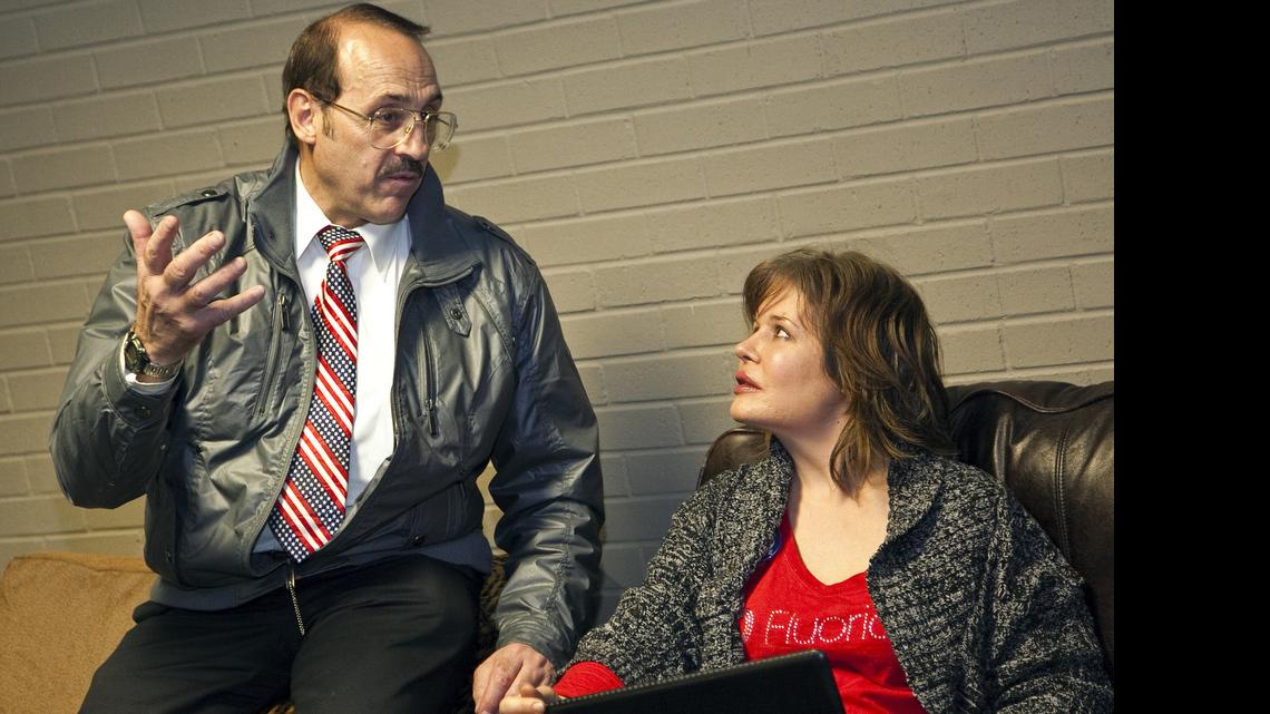 Mark S. Gietzen visits with Liesl Wright at the Wichitans Against Fluoridation election watch party Tuesday, Nov. 6, 2012.