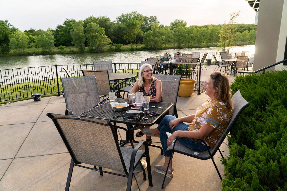 Dana Bain, left, and Shelly Mercer, right, enjoy the patio at Felipe’s West on June 4, 2020.