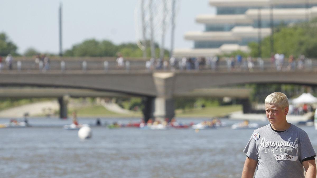 Festival goers check out the action on the Arkansas River at the Wichita River Festival Saturday. (June 2, 2012)