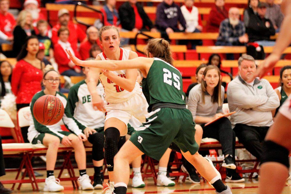 McPherson’s Emma Ruddle delivers a pass to the low block in the Bullpups loss to Derby on Friday. (Dec. 7, 2018)